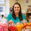 Sanija Pearse arranging colourful sweets behind the Varley & Vickers Treats counter in Wigan