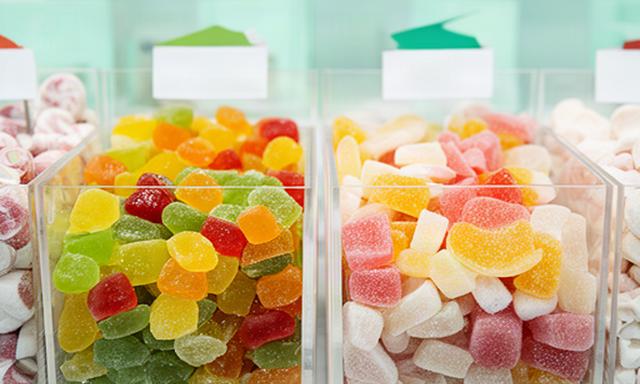 Clearly labelled vegan and gluten-free sweets in separate display tubs