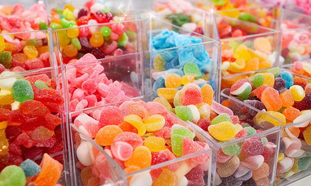 Bright pick and mix sweets in separated clear tubs at a Wigan sweet shop