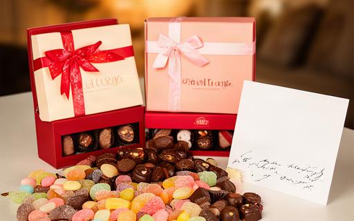 Date night duo with two chocolate gift boxes, sharing sweets and a handwritten message card