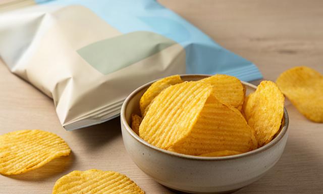 Sea salt crisps in a folded packet beside a small serving bowl